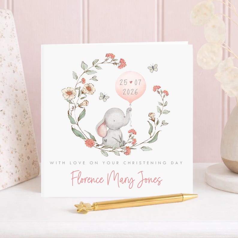 Personalised christening card for baby girl or boy featuring a cute little elephant illustration holding a balloon surrounded by a floral wreath. Perfect keepsake card suitable for christening, baptism, dedication day and more.
Custom name and date, pink or blue options. Printed on quality 300gsm lightly textured cardstock, measures 148 x 148mm and is supplied with a blank recycled kraft envelope.