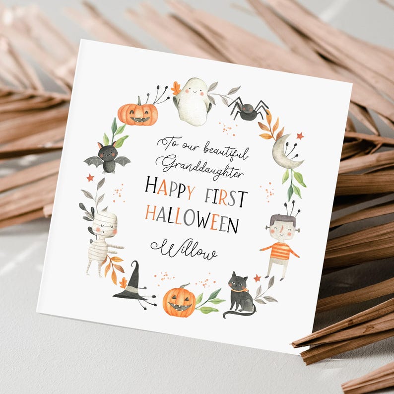 Personalised first Halloween card for baby featuring cute illustrations of pumpkin, ghost, spider, bat, mummy, black cat, and Frankenstein character in autumn colours. Includes custom relation and name with the message ‘Happy First Halloween' Perfect keepsake card for son, daughter, grandson, granddaughter, niece, or nephew celebrating their first spooky season. Printed on quality 300gsm lightly textured cardstock, measures 148 x 148mm and is supplied with a blank recycled kraft envelope.