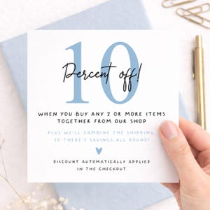 Etsy shop promotional card featuring 10 percent off when buying 2 or more greeting cards, pastel blue stationery background, handwritten typography and combined shipping savings notice.
