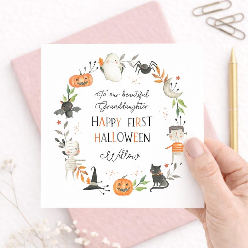 Personalised first Halloween card for a granddaughter featuring sweet Halloween characters including a ghost, pumpkin, mummy, bat, spider and black cat. The card reads Happy First Halloween and is personalised for a beautiful granddaughter or any relation