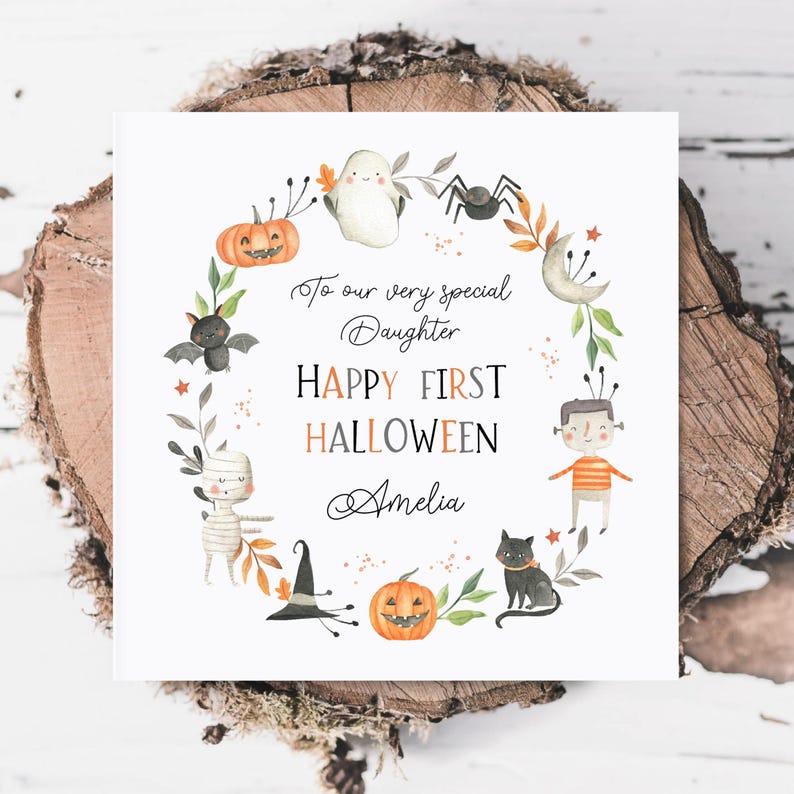 Personalised first Halloween card for baby featuring cute illustrations of pumpkin, ghost, spider, bat, mummy, black cat, and Frankenstein character in autumn colours. Includes custom relation and name with the message ‘Happy First Halloween' Perfect keepsake card for son, daughter, grandson, granddaughter, niece, or nephew celebrating their first spooky season. Printed on quality 300gsm lightly textured cardstock, measures 148 x 148mm and is supplied with a blank recycled kraft envelope.