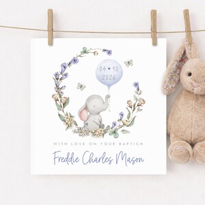 Personalised christening card for baby girl or boy featuring a cute little elephant illustration holding a balloon surrounded by a floral wreath. Perfect keepsake card suitable for christening, baptism, dedication day and more.
Custom name and date, pink or blue options. Printed on quality 300gsm lightly textured cardstock, measures 148 x 148mm and is supplied with a blank recycled kraft envelope.