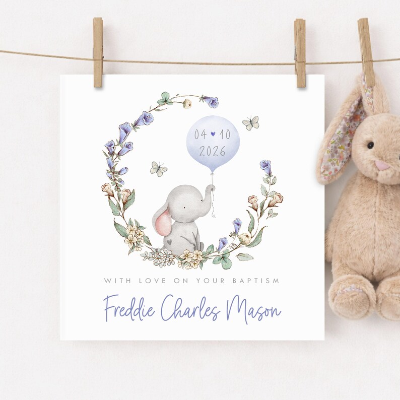 Personalised christening card for baby girl or boy featuring a cute little elephant illustration holding a balloon surrounded by a floral wreath. Perfect keepsake card suitable for christening, baptism, dedication day and more.
Custom name and date, pink or blue options. Printed on quality 300gsm lightly textured cardstock, measures 148 x 148mm and is supplied with a blank recycled kraft envelope.