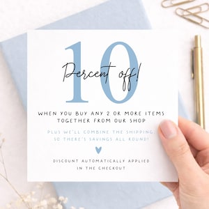 Etsy shop promotional card featuring 10 percent off when buying 2 or more greeting cards, pastel blue stationery background, handwritten typography and combined shipping savings notice.