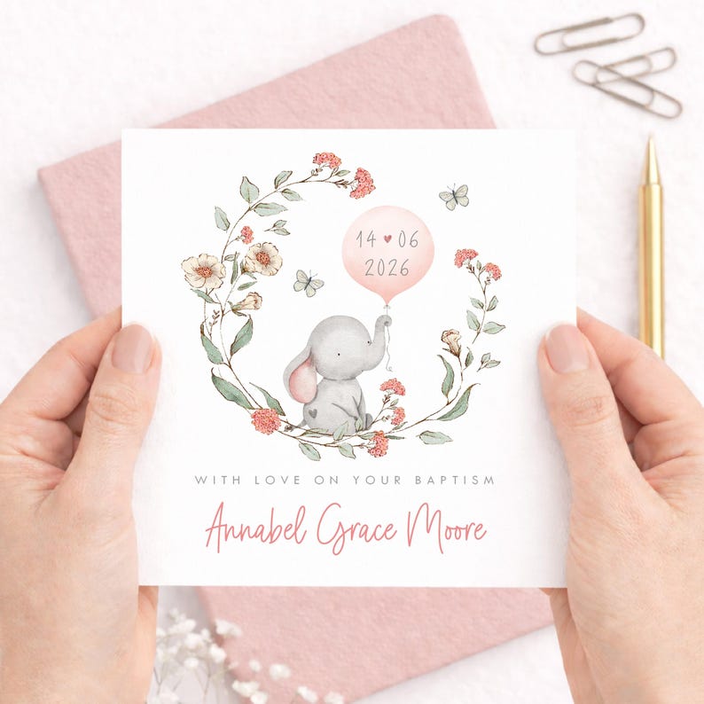 Personalised christening card for baby girl or boy featuring a cute little elephant illustration holding a balloon surrounded by a floral wreath. Perfect keepsake card suitable for christening, baptism, dedication day and more.
Custom name and date, pink or blue options. Printed on quality 300gsm lightly textured cardstock, measures 148 x 148mm and is supplied with a blank recycled kraft envelope.