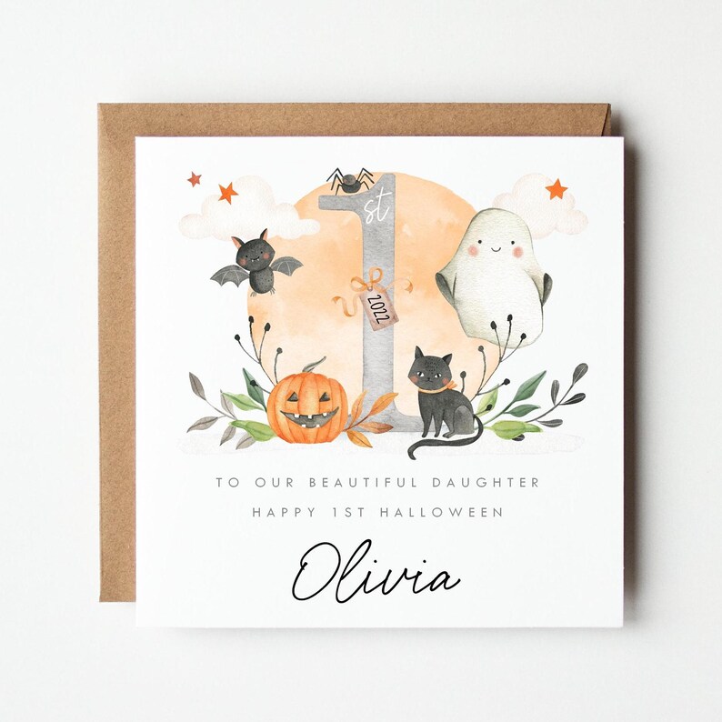 Personalised First Halloween Card for Baby. Custom Halloween Keepsake with Cute Ghost, Pumpkin, Black Cat, Bat, and '1st Halloween 2025' Design. Ideal for Son, Grandson, or Baby's First Halloween Gift. Features baby’s name and short personalised message. Perfect Halloween card for babies born in 2024 celebrating their first spooky season. Printed on quality 300gsm lightly textured cardstock, measures 148 x 148mm and is supplied with a blank recycled kraft envelope.