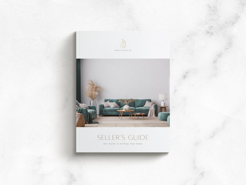 May include: A white booklet with the title "Seller's Guide" and the text "Your Guide to Selling Your Home". The cover features a photo of a living room with a teal sofa, a coffee table, and a vase with dried pampas grass.