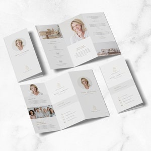May include: A tri-fold brochure with a white background and gold accents. The brochure features a headshot of a woman, a group photo of people, and text about interior design services. The text includes the name "Emily Thompson" and the phrase "Interior Design".