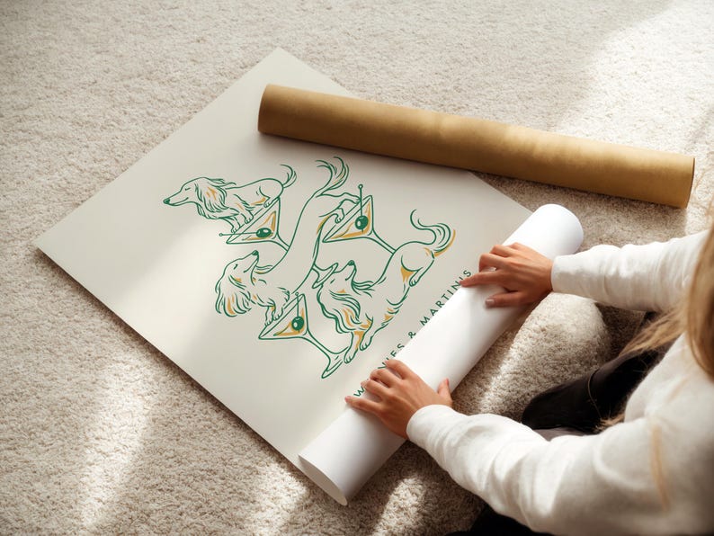 May include: A cream-colored poster featuring a green and orange line art illustration of four long-haired dachshunds interacting with martini glasses. The text "WAGS & MARTINIS" is printed in a dark green sans-serif font near the bottom right corner.