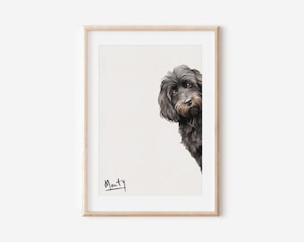 May include: A black and brown dog peeks around the corner of a white frame. The dog's name, "Monty", is written in black ink below the image.