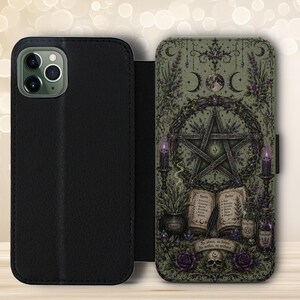 May include: A black wallet-style phone case featuring a detailed illustration of a pentagram, an open spellbook with the text 'Spells' and 'Herbs', candles, a skull, and the phrase 'As above, so below. As within, so without' in shades of green and purple.