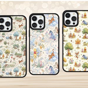 May include: Three smartphone cases with black frames and cream-coloured backings featuring repeating illustrations of Winnie the Pooh characters including Tigger, Eeyore, Piglet, and Rabbit in various forest settings with trees, flowers, and honey pots.