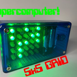 May include: A blue and green box with a grid of green LEDs and the text "Supercomputer!" above it. The box is labelled "SXS GRID" and has two batteries inside.