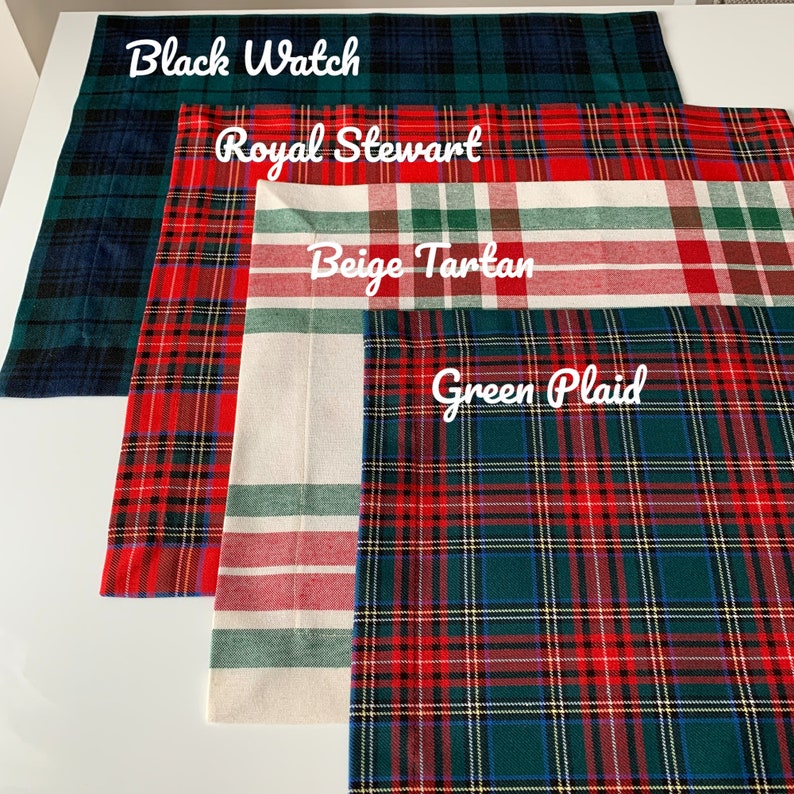 May include: Four different plaid fabric swatches with the names "Black Watch", "Royal Stewart", "Beige Tartan", and "Green Plaid" written on them.
