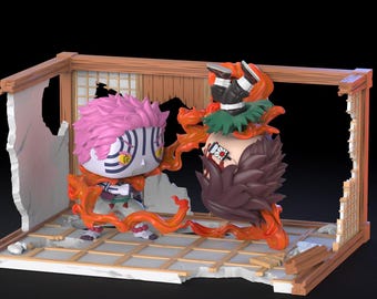 Puede incluir: Un diorama con dos figuras estilizadas de colores vibrantes. Una figura tiene el pelo rosa y la otra el pelo oscuro. Ambas figuras están rodeadas de llamas naranjas, dentro de una estructura de madera parcialmente destruida.