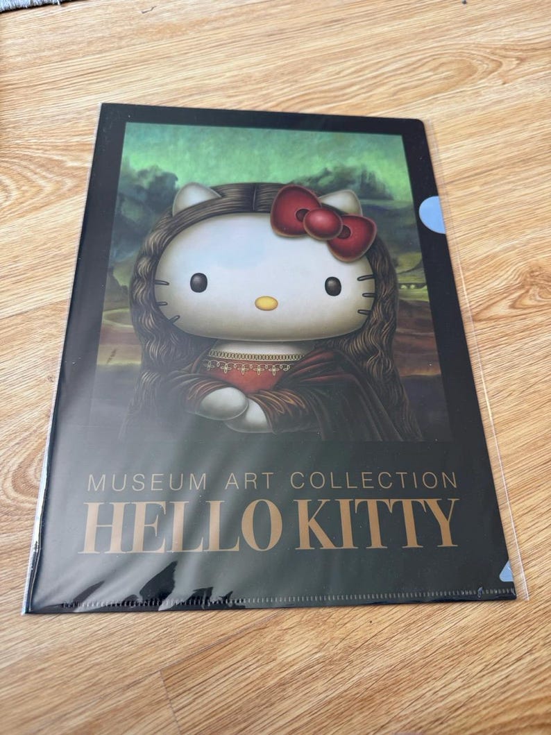 May include: A rectangular plastic document folder featuring a graphic of Hello Kitty styled as the Mona Lisa, complete with long dark hair, a red bow, and a dark dress. The text MUSEUM ART COLLECTION HELLO KITTY is printed in gold at the bottom.