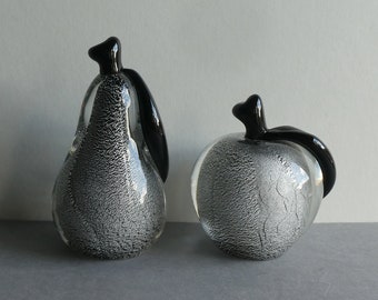 Two particularly rare Murano glass sculptures, apple and pear, Oball Sommerso, black with silver glitter, mouth-blown, 1970s.