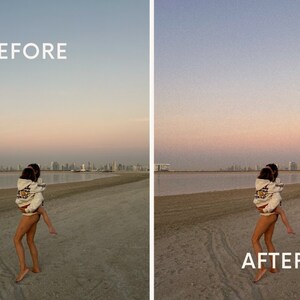 May include: Two people are walking on a sandy beach with a city skyline in the background. The person in the front is carrying the person behind them on their back. The sky is a light pink and blue color.