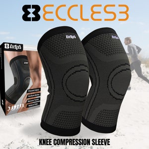 May include: Two black knee compression sleeves with a gray and black pattern. The sleeves have a circular design on the front and the text "Eccless" on the side. The text "KNEE COMPRESSION SLEEVE" is printed below the sleeves.