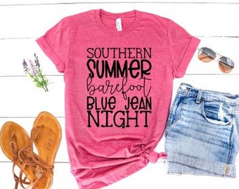 May include: Pink t-shirt with the text "Southern Summer Barefoot Blue Jean Night" in black lettering.