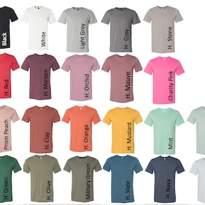 May include: A chart showing 20 different colors of t-shirts. The colors include black, white, light grey, grey, heather stone, red, maroon, orchid, mauve, charity pink, prism peach, clay, orange, mustard, mint, dusty blue, green, olive, military green, slate, navy, and light blue.