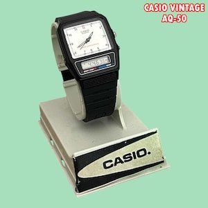 Raro orologio Casio AQ-50 vintage: quadrante bianco, movimento al quarzo giapponese, da collezione.