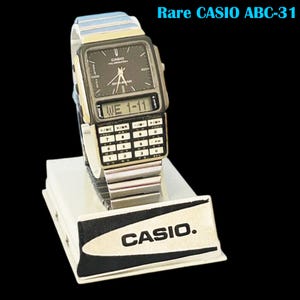 Ultra Rare Vintage Casio ABC-31 Data Bank Digital & Analog Black Dial Wrist Watch/ Original Casio Tin Box/ Retro Special model/ module: 2332