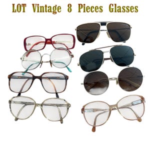 May include: A selection of eight vintage glasses, including spectacles and sunglasses. The frames are in various styles and colours, such as red, brown, silver, and gold. The text "LOT Vintage 8 Pieces Glasses" is at the top.