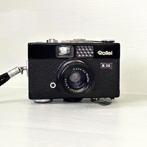 Vintage Rollei 35B Ultra Compact/ 35mm Film Camera / Retractable 40mm f3.5 Triotar lens + Rollei Wrist Strap/Orginal Case BLACK Color