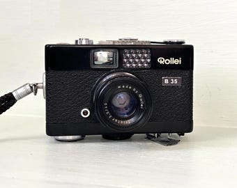 Vintage Rollei 35B Ultra Compact/ 35mm Film Camera / Retractable 40mm f3.5 Triotar lens + Rollei Wrist Strap/Orginal Case BLACK Color