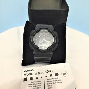 Reloj pulsera Casio G-Shock GA100 de cuerpo color negro, analógico