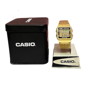 CASIO A500W World Time Gold color watch  casual square Very good condition  Casio Tin Box