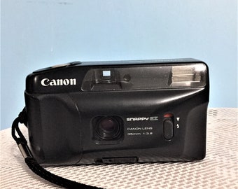 Canon Snappy Ez Film Camera Point and Shoot/35mm Vintage Camera 1980s/ Very good condition/. Works well and has been tested.