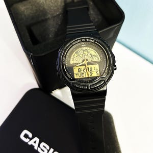 CASIO AW-21U WORLD Time Watch Rare watch Vintage mod:387 Very Good Condition  Casio Tin Box