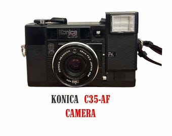 コニカ FC-1 フィルムカメラ（50 mm f/1.8 および 28 mm f/3.5 レンズ