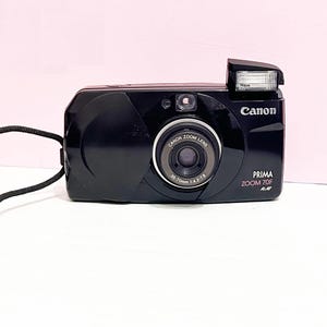 Analog Canon Prima  Zoom 70 F/ Zoom  35mm Compact/Black Analog Camera //Great condition/ Black Color /With Gp Cr123a Battery