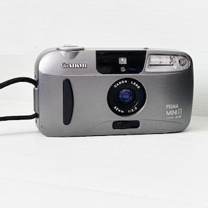 Canon Prima mini II Date/ Canon Lens 35mm Compact AF Camera/Point & Shoot Film Camera/Film tested and fully working/ With Gp Battery Cr123a