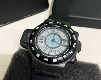 RARO RELOJ DIGITAL CASIO CPW-100/Módulo 1031 VINTAGE/MUY BUEN ESTADO/CAJA  DE LATA CASIO/MARCA JAPONESA