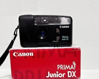 Unused Canon Prima Junior DX point and shoot compact film camera/ Original box / Case and Battery / Working Very Good