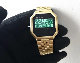 Nixon The Re-RUN Gold Tone Watch  Man & Women Wristwatch Very good condition and cosmetics Steel Case Steel  Adjustable Bracelet