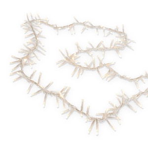 May include: A string of cluster fairy lights featuring numerous small, warm white LED bulbs attached to a thin, flexible silver wire. The lights are arranged in a dense, multi-directional pattern along the length of the wire, creating a bright effect.