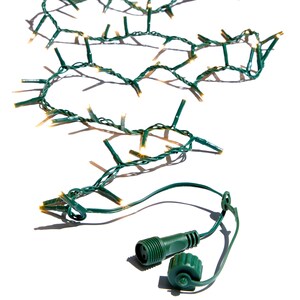 May include: Green Christmas string lights with small, clear bulbs. The lights are connected by a green wire and have a green connector with a cap. The lights are on a white background.