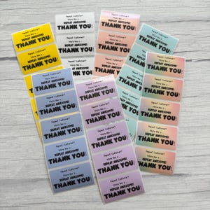 May include: A collection of rectangular stickers in various pastel colors, including yellow, white, pink, and blue. Each sticker features the text "Repeat Customer? More like a... REPEAT AWESOME! THANK YOU!" in black.