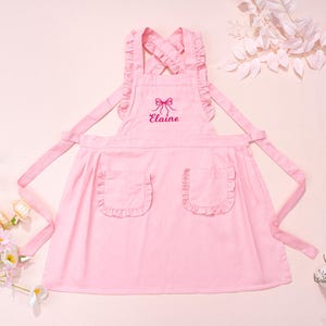 Girls Apron for Kids Personalized Toddler Apron with Bow Custom Cooking Pinafore Ruffle Apron with Pockets Birthday Gifts for Child/Girls