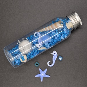 Sensory sound bottle, rattle, Montessori method, calming, seahorse, blue