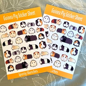 May include: Two sheets of stickers featuring adorable guinea pig illustrations. Each sheet has a variety of poses and expressions, with a yellow background and the text "Guinea Pig Sticker Sheet" and "Spotty Sketches".