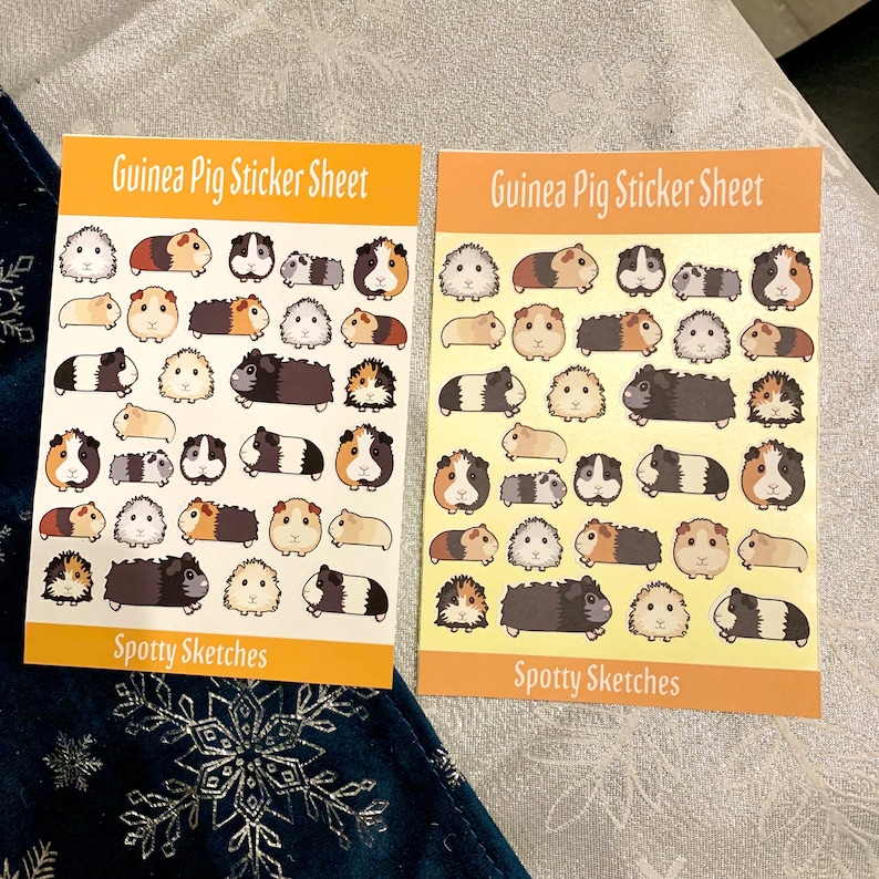 May include: Two sheets of stickers featuring adorable guinea pigs in various poses. Each sheet has the title "Guinea Pig Sticker Sheet" and "Spotty Sketches" at the bottom. The stickers are on a yellow background with a white border.