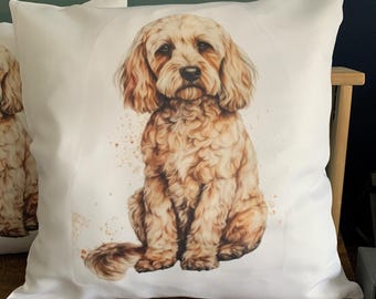 May include: White square throw pillow featuring a watercolor illustration of a golden doodle dog. The dog is sitting, with a soft, fluffy coat and expressive eyes. Brown watercolor splatters surround the dog, adding a touch of artistic flair. The pillow is on a wooden surface.