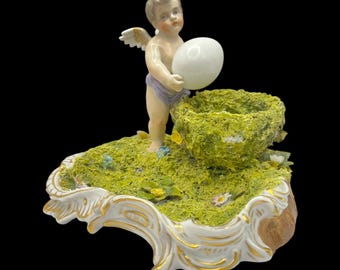 Antique Sitzendorf Porcelain Putto Figurine with Egg & Nest • ca. 1890–1920 • Voigt Bros • German Porcelain