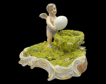 Antique Sitzendorf Porcelain Putto Figurine with Egg & Nest • ca. 1890–1920 • Voigt Bros • German Porcelain